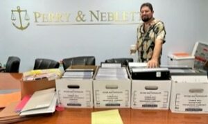 Perry & Neblett Win Jury Trial against Tower Hill Insurance Lawyers. $35,000 Paid plus expenses for the client. David Neblett, Esq. with case files